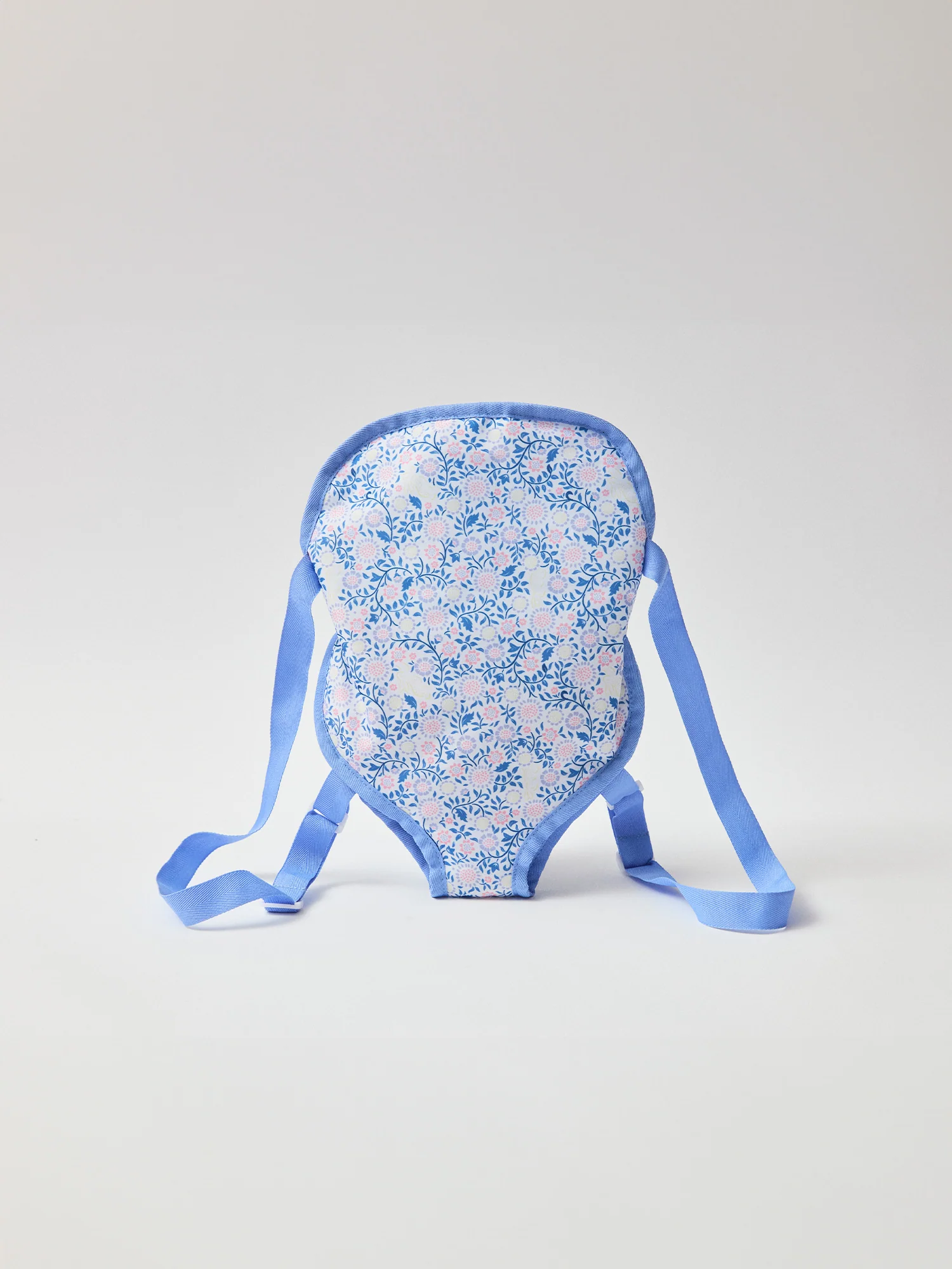 Porte poupée bleu imprimé fleuri
