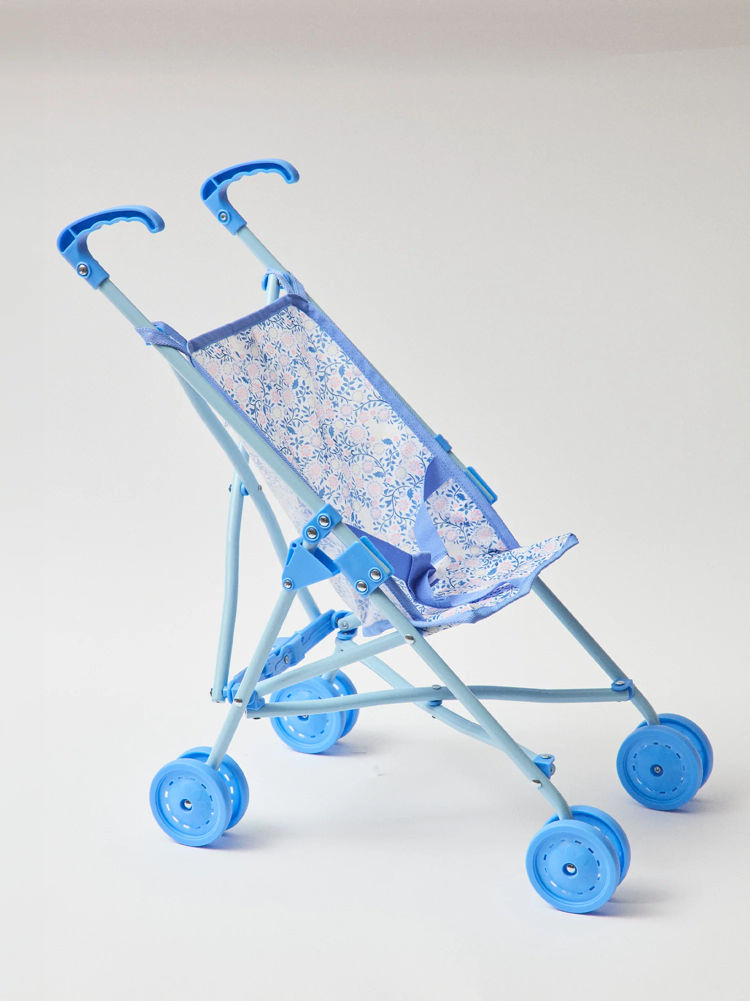 Poussette poupée bleu imprimé fleuri